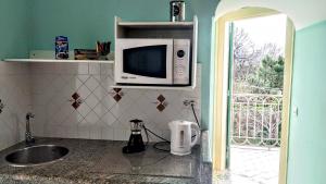 TV a/nebo společenská místnost v ubytování B&B Relax + 36 fotografií