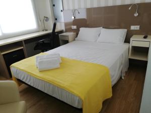 Posteľ alebo postele v izbe v ubytovaní Residencia Compostela
