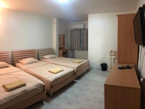 Postel nebo postele na pokoji v ubytování TK Guesthouse