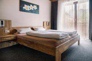 Postel nebo postele na pokoji v ubytování Apartments Gletscherblick