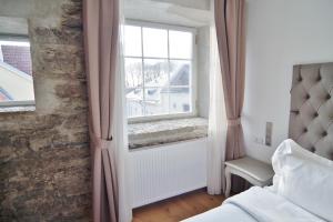 Postel nebo postele na pokoji v ubytování Hotel Regent Tallinn