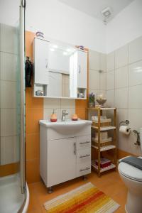 a bathroom with a sink and a shower and a toilet at Casa Eleni in Kanálion