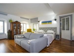 a living room with a bed and a couch at Palace Tower View in Split