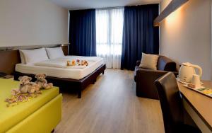 Postel nebo postele na pokoji v ubytování Best Western Hotel Adige