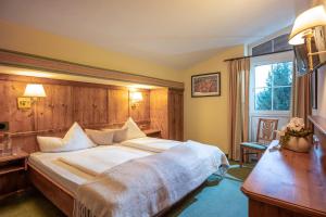 Łóżko lub łóżka w pokoju w obiekcie Hotel Sonnschein