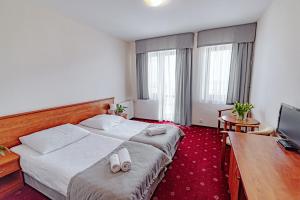 Postel nebo postele na pokoji v ubytování Panorama_SPA
