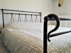 A bed or beds in a room at La Bomboniera