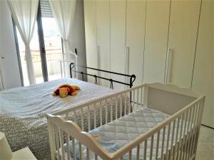 A bed or beds in a room at La Bomboniera