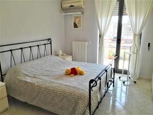 A bed or beds in a room at La Bomboniera