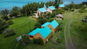 an aerial view of a house with blue roofs at La Belle Rodriguaise in Rodrigues Island