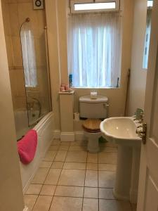 a bathroom with a toilet and a sink and a shower at Southwell in Southwell