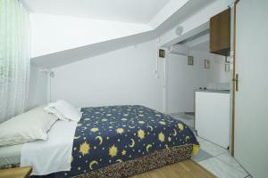 Postel nebo postele na pokoji v ubytování Apartmani Križanović