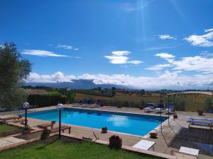 a swimming pool with a view of the mountains at Agriturismo San Cristoforo di Marco e Andrea in Amelia