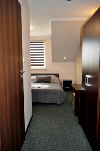 Łóżko lub łóżka w pokoju w obiekcie Hotel Pauza