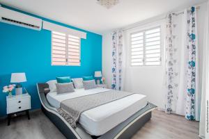 Postel nebo postele na pokoji v ubytování Le Brin d'Amour Apartment