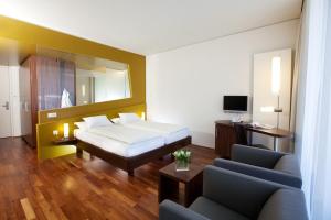 Postel nebo postele na pokoji v ubytování Spa Hotel Bründl