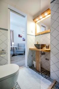 a bathroom with a toilet and a sink at Casa Colloredo Free Parking in Rovinj