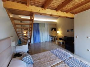a living room with a staircase and a living room at Sidari Waterpark in Sidari