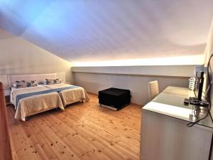 a bedroom with two beds in a room with a ceiling at Sidari Waterpark in Sidari