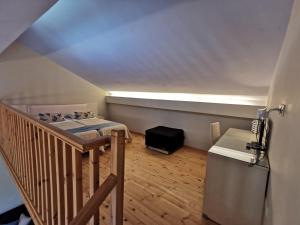 a small room with a bed and a staircase at Sidari Waterpark in Sidari