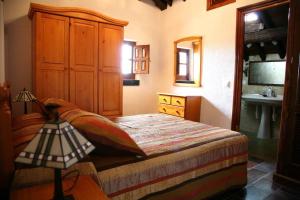 a bedroom with a bed and a sink in it at CASA TEO in Ávila