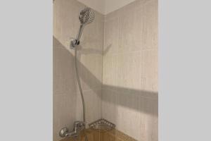 a shower with a shower head in a bathroom at Apartamento primera línea de Mar Enjoy the view in Blanes