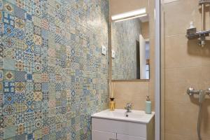 a bathroom with a toilet and a sink and a mirror at Cozy Studio Alvalade in Lisbon +6 photos