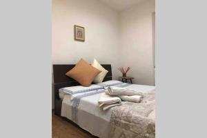 A bed or beds in a room at Nicole Maison