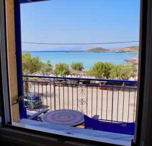 a view of the ocean from a balcony at Hotel Notara in Diakofti