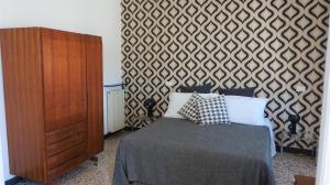 Postel nebo postele na pokoji v ubytování Le coccole
