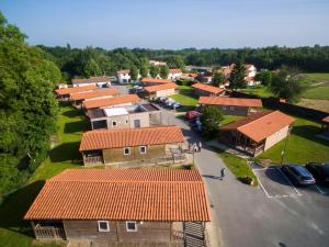 an aerial view of a small village with orange roofs at Chateau De La Plinguetiere in Saint-Aignan-Grand-Lieu +4 photos