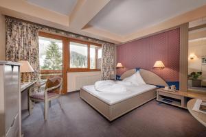 Postel nebo postele na pokoji v ubytování Hotel St. Oswald