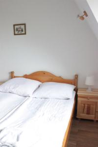 Postel nebo postele na pokoji v ubytování Pokoje Granaty