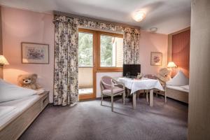 Postel nebo postele na pokoji v ubytování Hotel St. Oswald