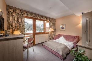 Postel nebo postele na pokoji v ubytování Hotel St. Oswald