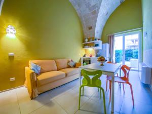 a living room with a couch and a table at Al Giardino Del Nespolo in Polignano a Mare +36 photos