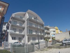 a large white building with a round top at New Alfieri - Agenzia Cocal in Caorle