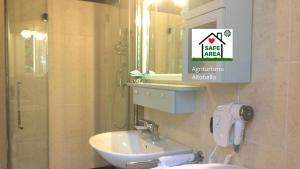 a bathroom with a sink and a mirror at Agriturismo Altobello in Verona