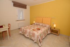 A bed or beds in a room at Agriturismo Villa Adimari