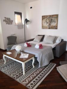 A bed or beds in a room at Perugino Apartments