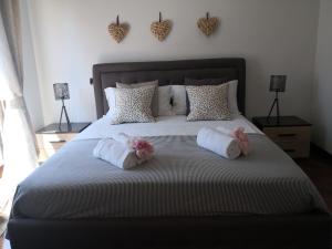 A bed or beds in a room at Perugino Apartments