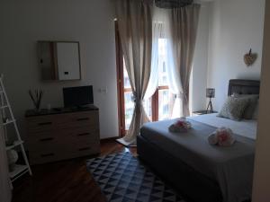 A bed or beds in a room at Perugino Apartments