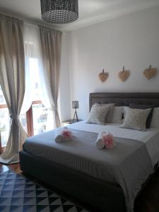 A bed or beds in a room at Perugino Apartments