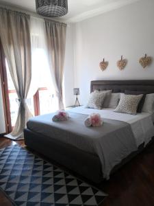 Perugino Apartments tesisinde bir odada yatak veya yataklar