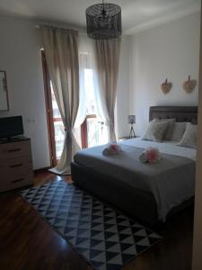A bed or beds in a room at Perugino Apartments