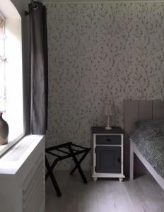 En eller flere senge i et værelse på Bed en Breakfast de Houtwiel