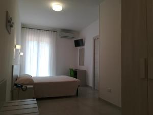 En eller flere senge i et værelse på Hotel Sfinalicchio