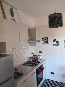 A kitchen or kitchenette at Perugino Apartments
