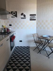 A kitchen or kitchenette at Perugino Apartments