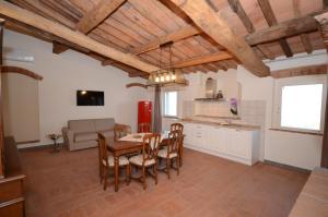 a kitchen and dining room with a table and chairs at Agriturismo Villa Adimari in Cerreto Guidi